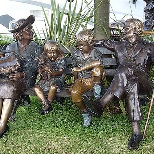 Hollow Cast Bronze Family Sitting on a Bench : Commission